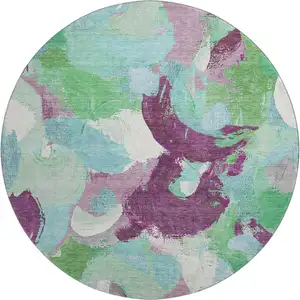Photo of 8' Teal Purple And Green Abstract Washable Round Rug With UV Protection
