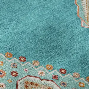 Photo of 8' Teal Salmon And Beige Oriental Washable Round Rug With UV Protection