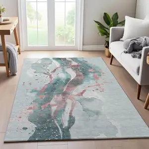 Photo of 8' Teal Salmon And Ivory Abstract Washable Area Rug With UV Protection