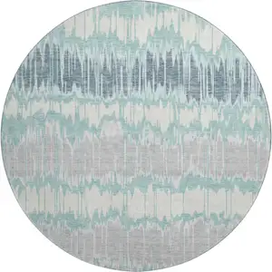 Photo of 8' Teal Silver And Gray Striped Washable Round Rug With UV Protection