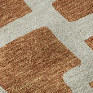 Photo of 8' Terra Cotta And Beige Abstract Geometric Washable Round Rug With UV Protection