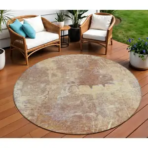 Photo of 8' Terra Cotta And Beige Round Abstract Washable Indoor Outdoor Area Rug