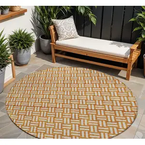 Photo of 8' Terra Cotta And Beige Round Geometric Washable Indoor Outdoor Area Rug