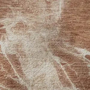 Photo of 8' Terra Cotta And Ivory Abstract Washable Round Rug With UV Protection