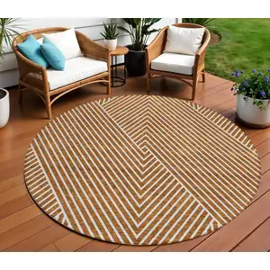 Photo of 8' Terra Cotta And Ivory Round Geometric Washable Indoor Outdoor Area Rug