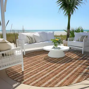 Photo of 8' Terra Cotta And Ivory Round Striped Washable Indoor Outdoor Area Rug
