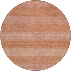 Photo of 8' Terra Cotta And Peach Round Striped Washable Indoor Outdoor Area Rug