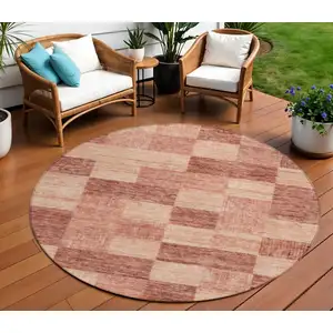 Photo of 8' Terra Cotta And Pink Round Geometric Washable Indoor Outdoor Area Rug