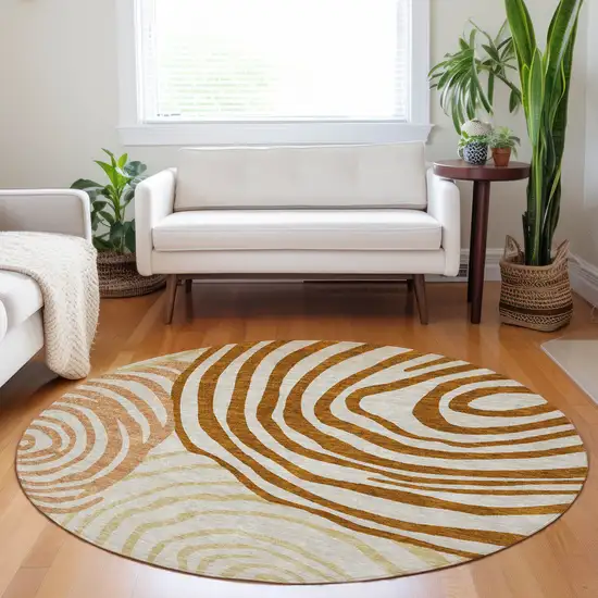 8' Terra Cotta Beige And Gold Abstract Washable Round Rug With UV Protection Photo 5