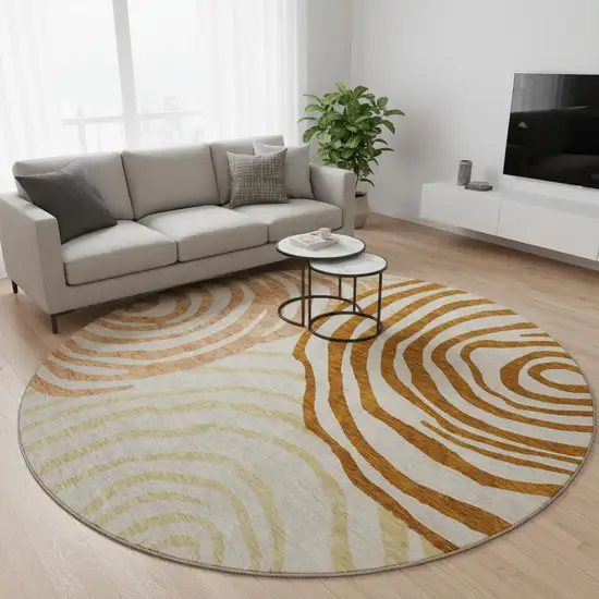 8' Terra Cotta Beige And Gold Abstract Washable Round Rug With UV Protection Photo 2