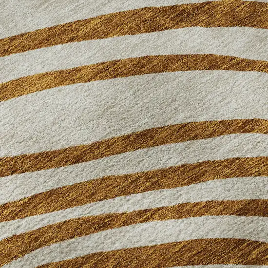 8' Terra Cotta Beige And Gold Abstract Washable Round Rug With UV Protection Photo 9