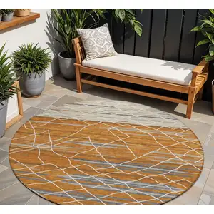 Photo of 8' Terra Cotta Beige And Ivory Round Striped Washable Indoor Outdoor Area Rug