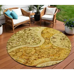 Photo of 8' Terra Cotta Brown And Gold Round Floral Medallion Washable Indoor Outdoor Area Rug