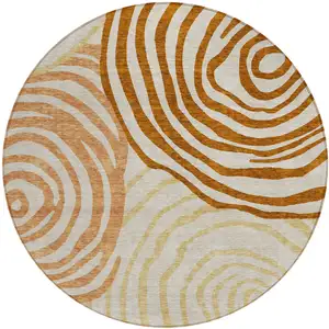 Photo of 8' Terra Cotta Copper And Gold Round Abstract Washable Indoor Outdoor Area Rug