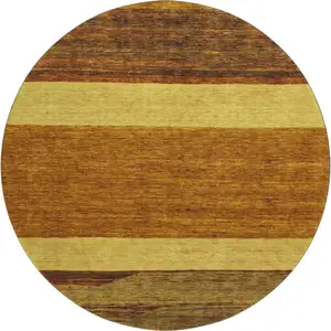 Photo of 8' Terra Cotta Gold And Brown Striped Washable Round Rug With UV Protection