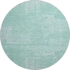 Photo of 8' Turquoise And Ivory Abstract Washable Round Rug With UV Protection
