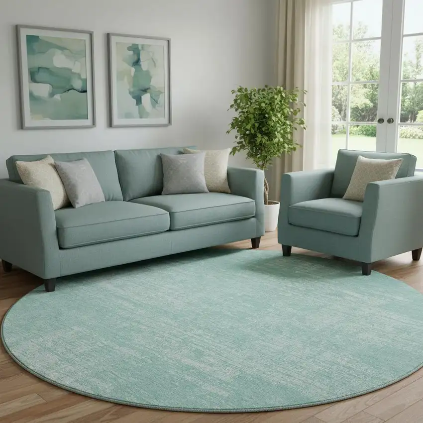 8' Turquoise And Ivory Abstract Washable Round Rug With UV Protection Photo 1
