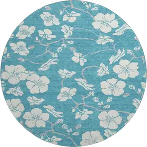 Photo of 8' Turquoise And Ivory Floral Washable Round Rug With UV Protection