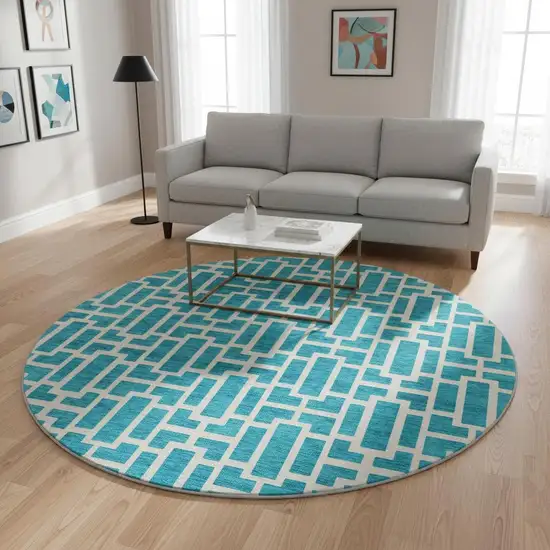 8' Turquoise And Ivory Geometric Washable Round Rug With UV Protection Photo 2