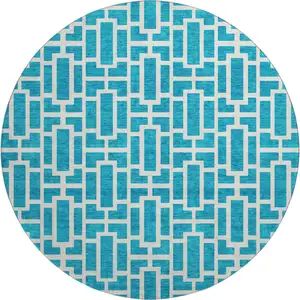 Photo of 8' Turquoise And Ivory Geometric Washable Round Rug With UV Protection