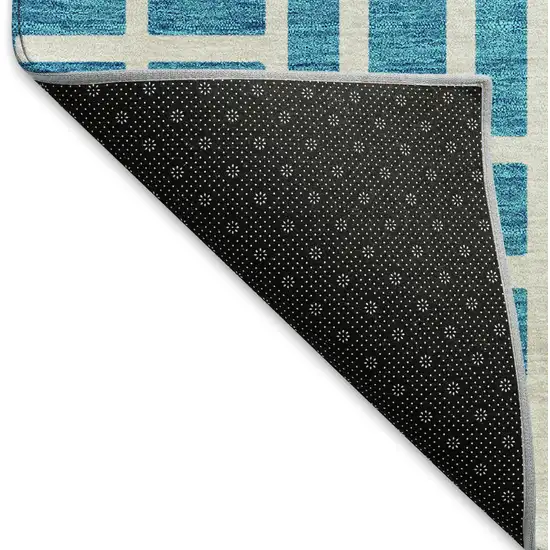 8' Turquoise And Ivory Geometric Washable Round Rug With UV Protection Photo 6