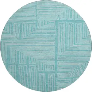 Photo of 8' Turquoise And Ivory Geometric Washable Round Rug With UV Protection