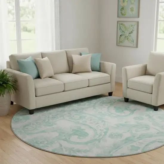 8' Turquoise And Ivory Paisley Washable Round Rug With UV Protection Photo 1
