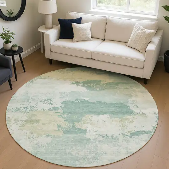 8' Turquoise And Ivory Round Abstract Washable Indoor Outdoor Area Rug Photo 5
