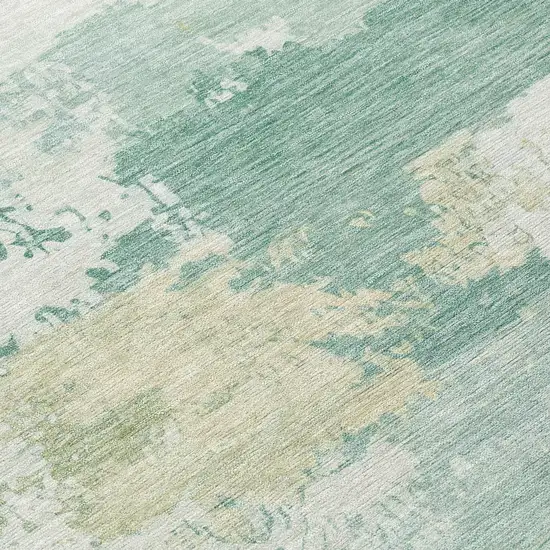 8' Turquoise And Ivory Round Abstract Washable Indoor Outdoor Area Rug Photo 9