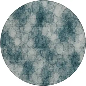 Photo of 8' Turquoise And Ivory Round Abstract Washable Indoor Outdoor Area Rug