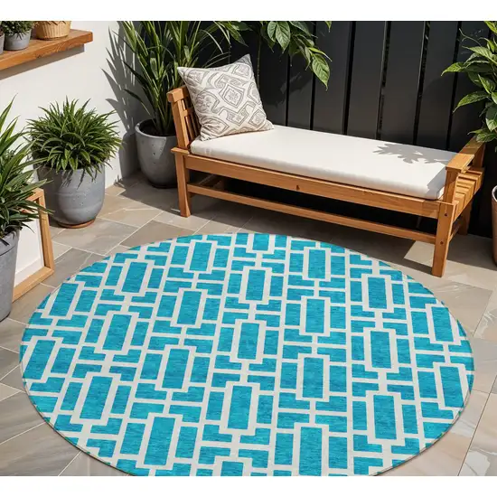 8' Turquoise And Ivory Round Geometric Washable Indoor Outdoor Area Rug Photo 7