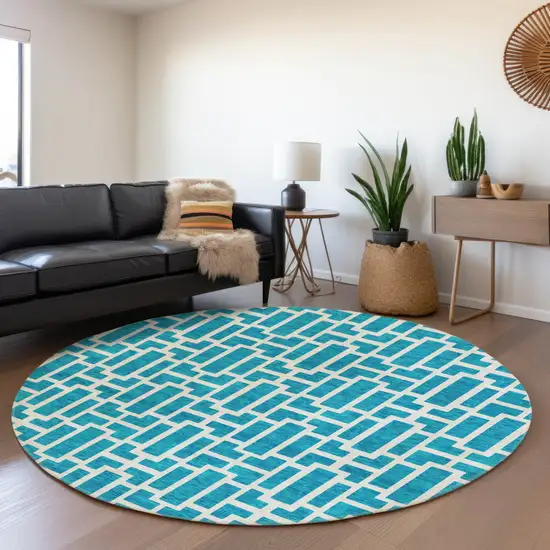 8' Turquoise And Ivory Round Geometric Washable Indoor Outdoor Area Rug Photo 4