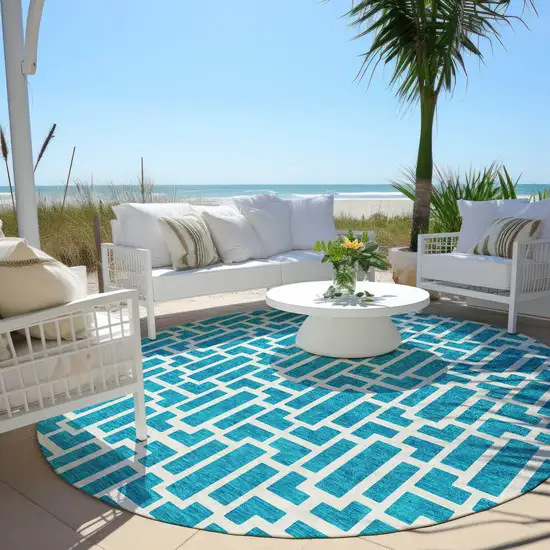 8' Turquoise And Ivory Round Geometric Washable Indoor Outdoor Area Rug Photo 3