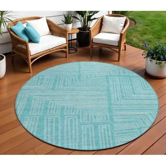 8' Turquoise And Ivory Round Geometric Washable Indoor Outdoor Area Rug Photo 1