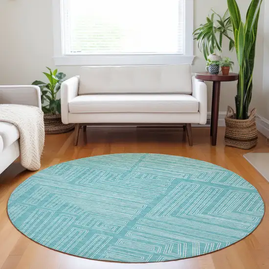 8' Turquoise And Ivory Round Geometric Washable Indoor Outdoor Area Rug Photo 8