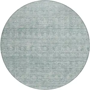 Photo of 8' Turquoise And Ivory Round Striped Washable Indoor Outdoor Area Rug