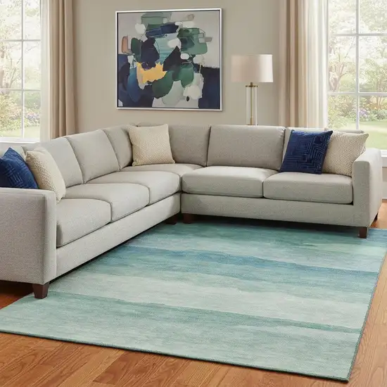 8' Turquoise And Ivory Striped Washable Area Rug With UV Protection Photo 1