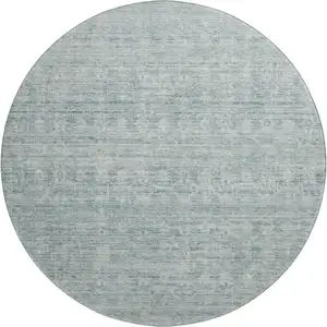 Photo of 8' Turquoise And Ivory Striped Washable Round Rug With UV Protection