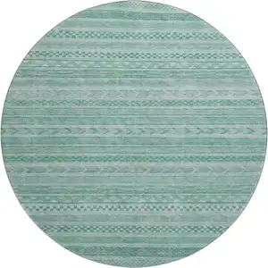 Photo of 8' Turquoise And Teal Striped Washable Round Rug With UV Protection