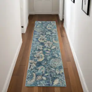 Photo of 7' Turquoise Cream and Navy Blue Floral Distressed Runner Rug