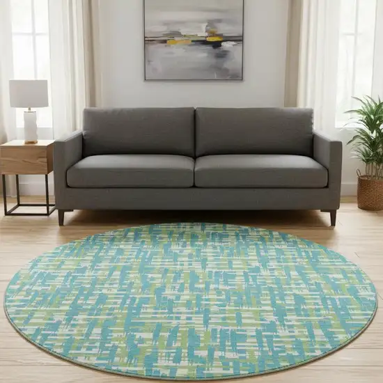 8' Turquoise Green And Ivory Abstract Geometric Washable Round Rug With UV Protection Photo 2