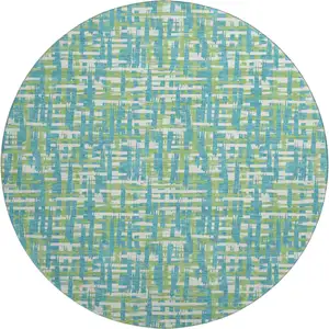 Photo of 8' Turquoise Green And Ivory Abstract Geometric Washable Round Rug With UV Protection