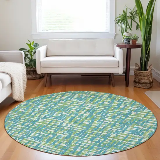 8' Turquoise Green And Ivory Round Abstract Washable Indoor Outdoor Area Rug Photo 9