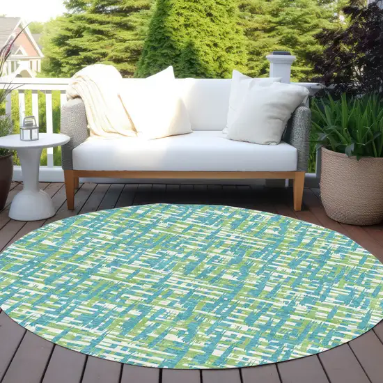 8' Turquoise Green And Ivory Round Abstract Washable Indoor Outdoor Area Rug Photo 8