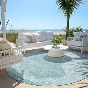 Photo of 8' Turquoise Teal Blue And Ivory Round Abstract Washable Indoor Outdoor Area Rug