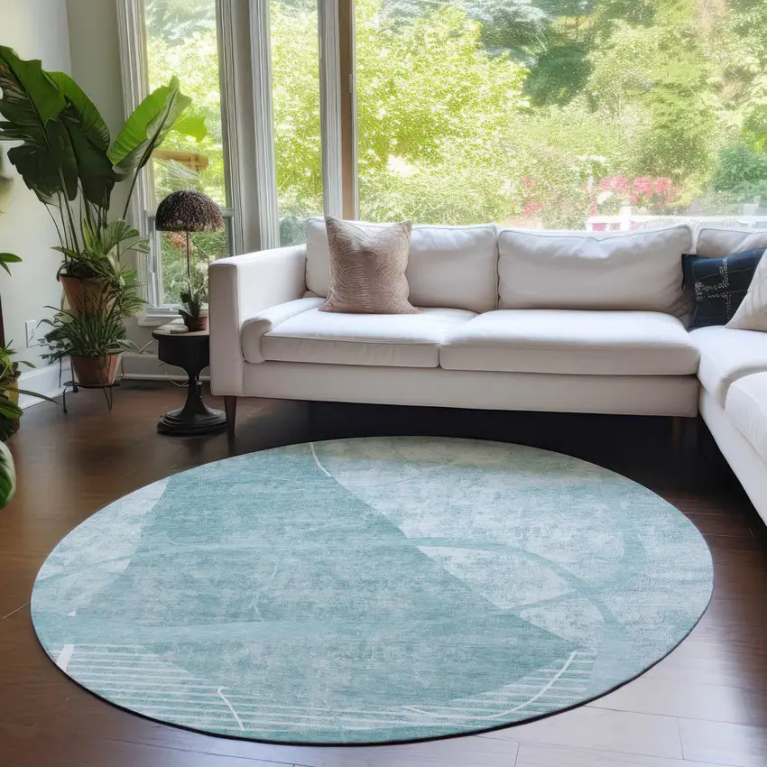 8' Turquoise Teal Blue And Ivory Round Abstract Washable Indoor Outdoor Area Rug Photo 7