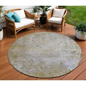 Photo of 8' Wheat And Beige Round Floral Washable Indoor Outdoor Area Rug