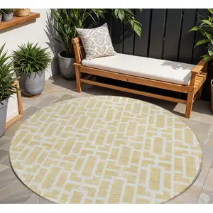 Photo of 8' Wheat And Ivory Round Geometric Washable Indoor Outdoor Area Rug