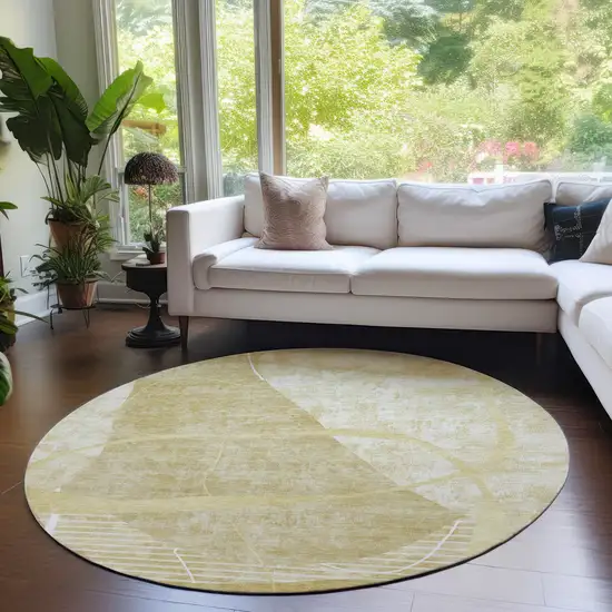 8' Wheat Gold And Ivory Round Abstract Washable Indoor Outdoor Area Rug Photo 7