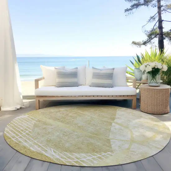 8' Wheat Gold And Ivory Round Abstract Washable Indoor Outdoor Area Rug Photo 6
